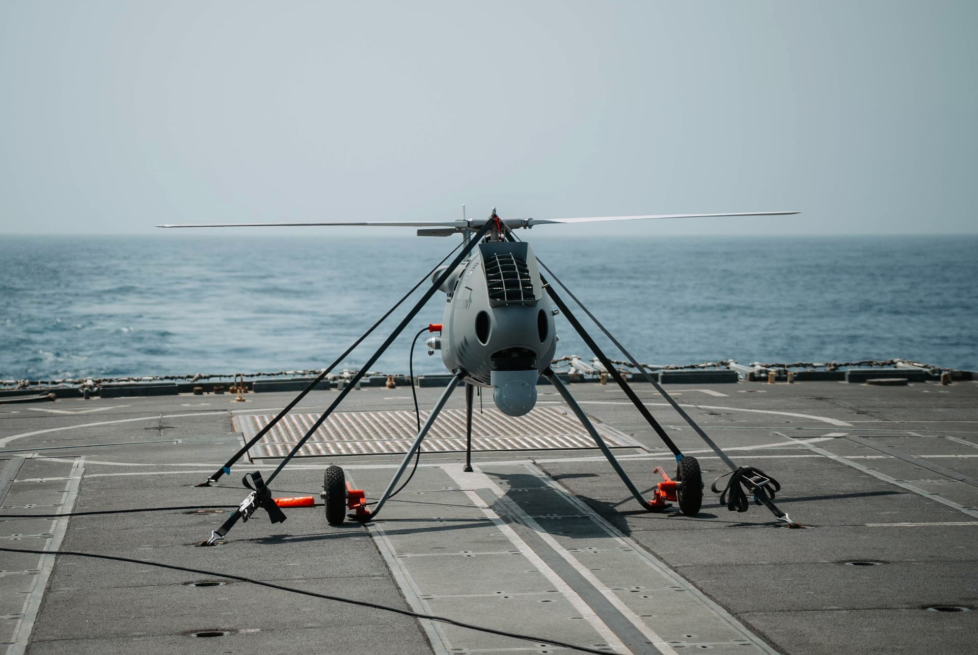 Uncrewed rotor aircraft on a vessel deck.